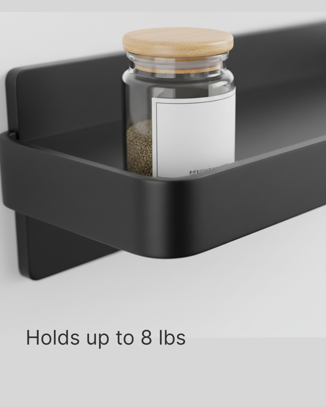 Black shelf with a glass jar labeled 